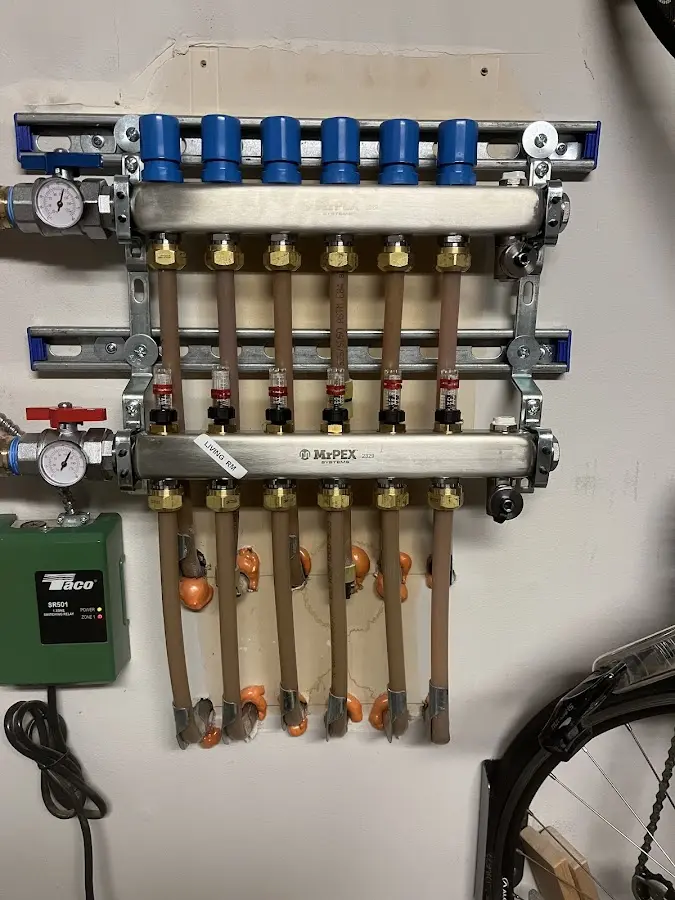 Plumber performing Water Heater Repair at a residential property in Great Neck Plaza